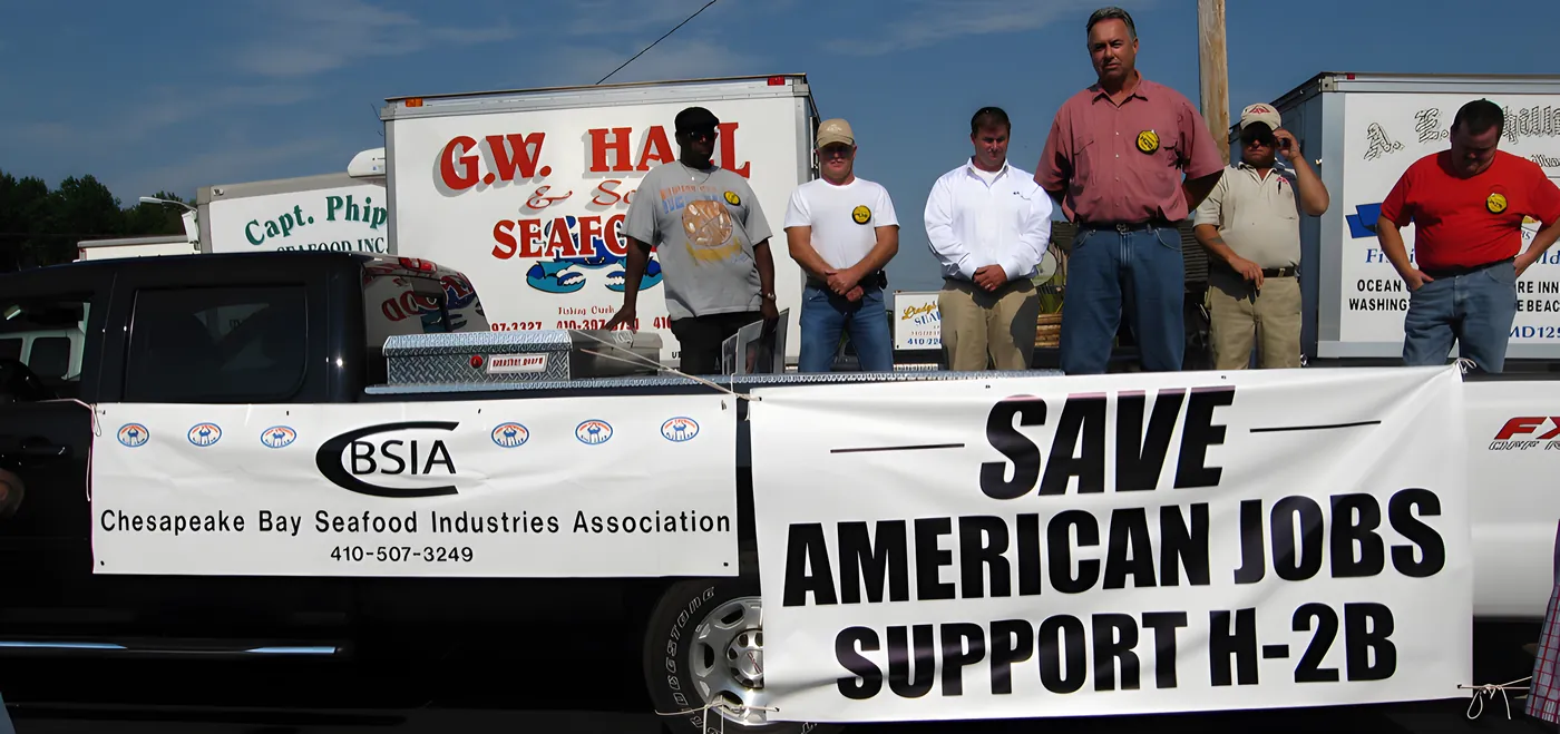 CBSIA members standing behind a banner reading Save American Jobs, Support H-2B